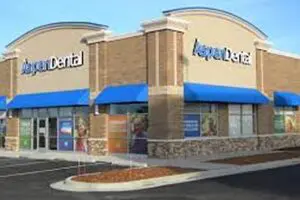 A dental office with blue and tan walls.